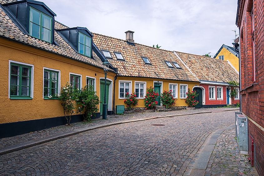 Town houses in medieval street in Lund, Sweden on summer day