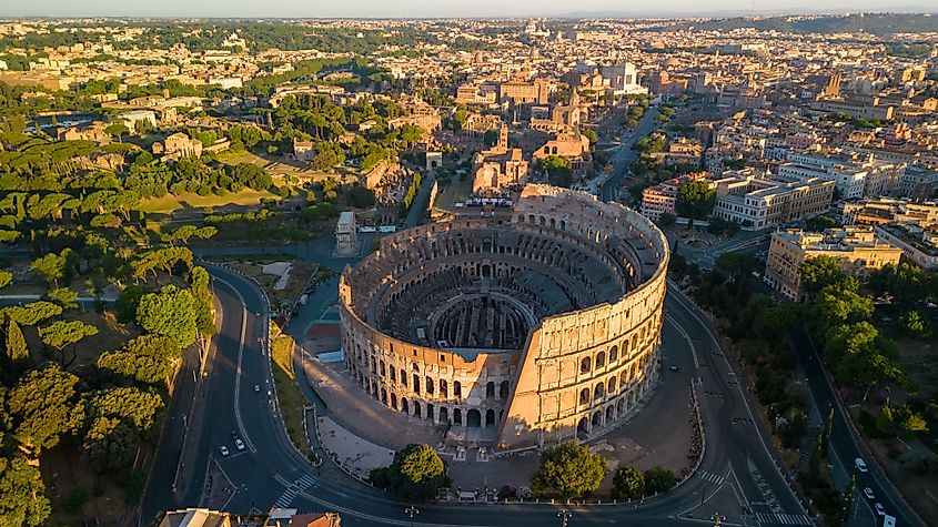An aerial view of the historic Colosseum and surrounding buildings in Rome, Italy