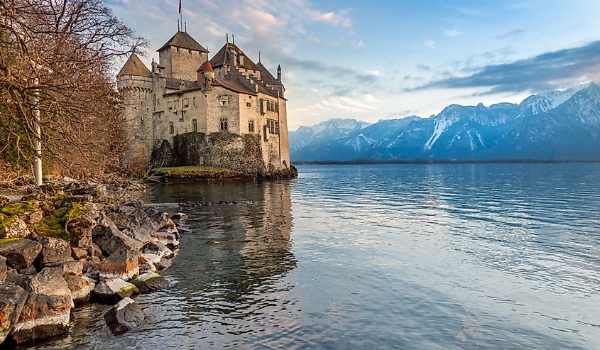 Chillon castle reflected in Geneva lake in the afternoon, Montreux, Switzerland