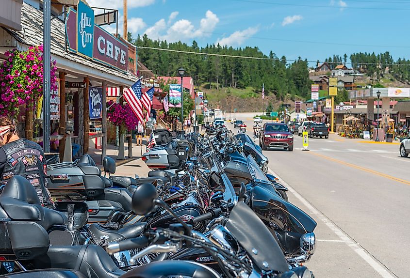 Bikes and Bikers gathering in Hill City for the 79th annual Sturgis Motorcycle Rally. Image credit mcrvlife via Shutterstock.