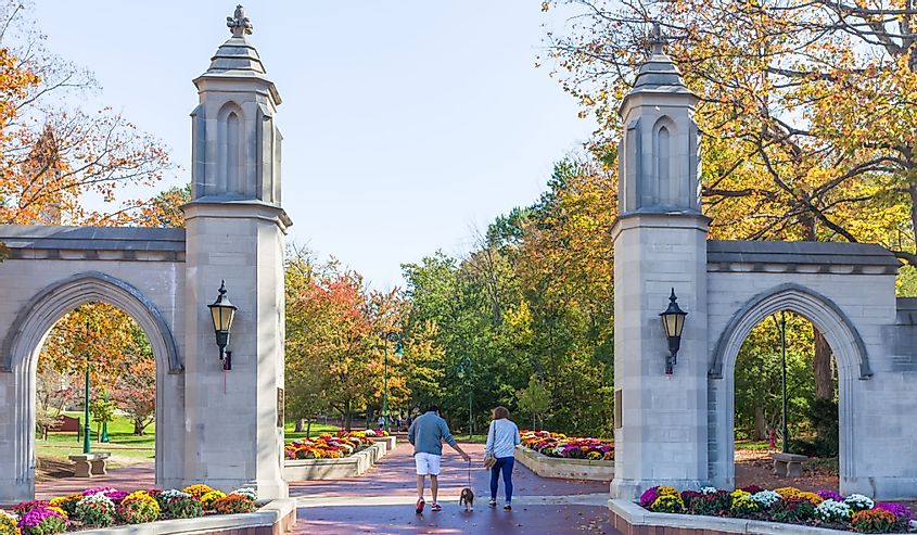 Unidentified individuals and Sample Gates on the campus of the University of Indiana.