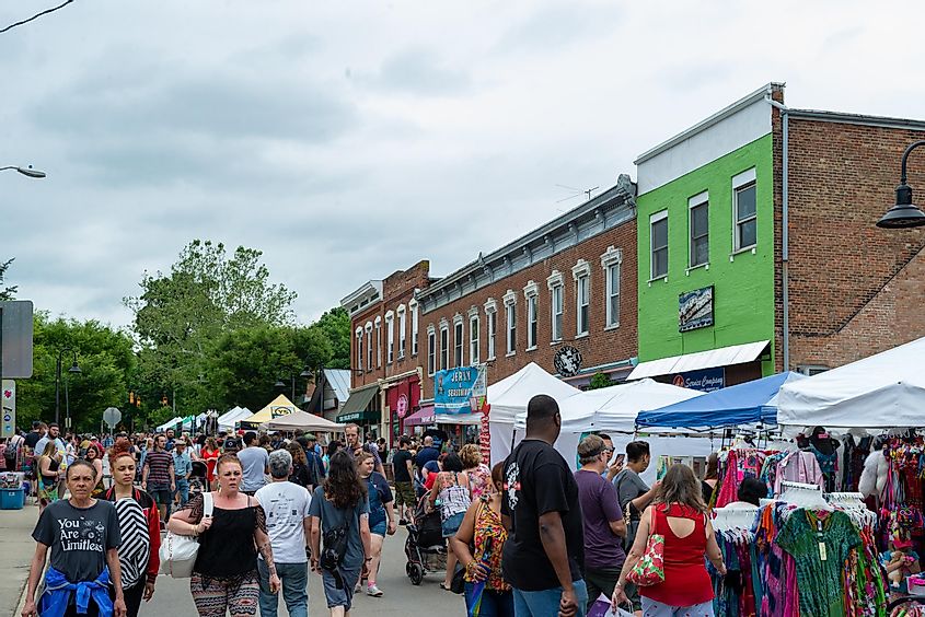 People shopping and browsing at a public street fair in Yellow Springs, Ohio, via Adam Lovelace / Shutterstock.com