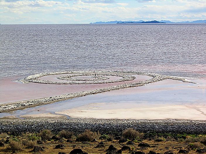 Person standing in the middle of Spiral Jetty, viewed from the shore