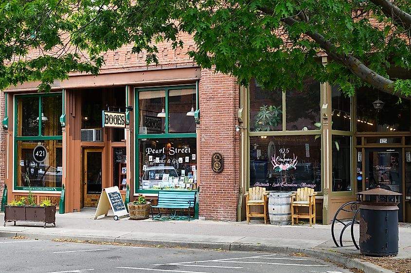 Businesses in the historic Lynch Block of downtown Ellensburg Washington with a bookshop and a full service salon, via Ian Dewar Photography / Shutterstock.com
