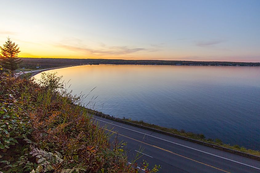 Coastal highway along Keweenaw Bay of Lake Superior at sunset in Michigan’s Upper Peninsula