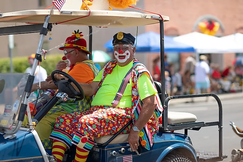 The Strassenfest Parade, Clowns, members of Funsters, driving a clown car down the street during the parade.