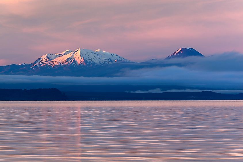 Lake Taupo with Mount Ruapehu and Mount Ngauruhoe at dawn, Taupo, North Island, New Zealand.