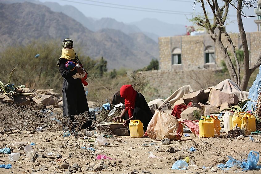 Yemeni women live in the open after being displaced from their homes due to the war in Taiz