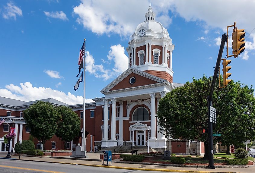 Flags fly in front of the Upshur County Court House in Buckhannon, West Virginia