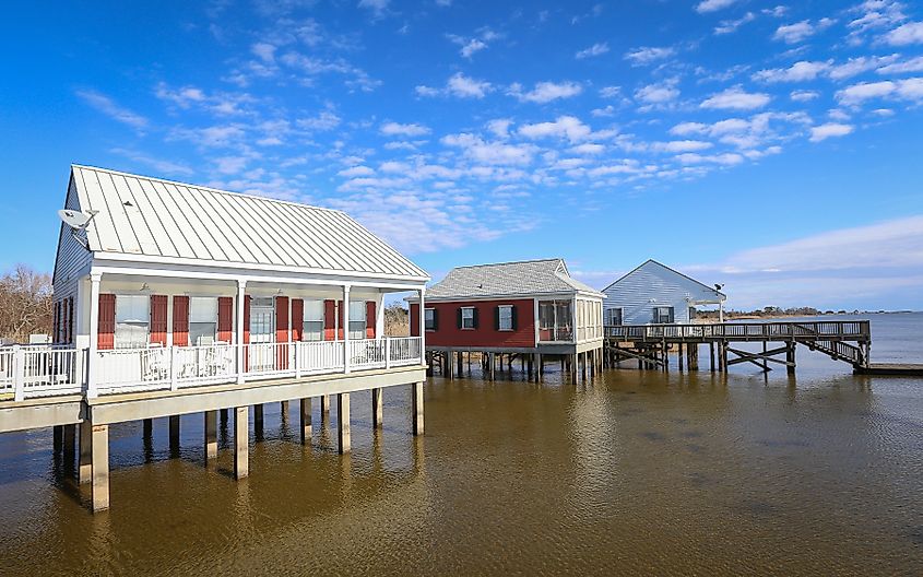 Rental cabins perched over Lake Pontchartrain inside Fontainebleau State Park in Mandeville, Louisiana, USA.