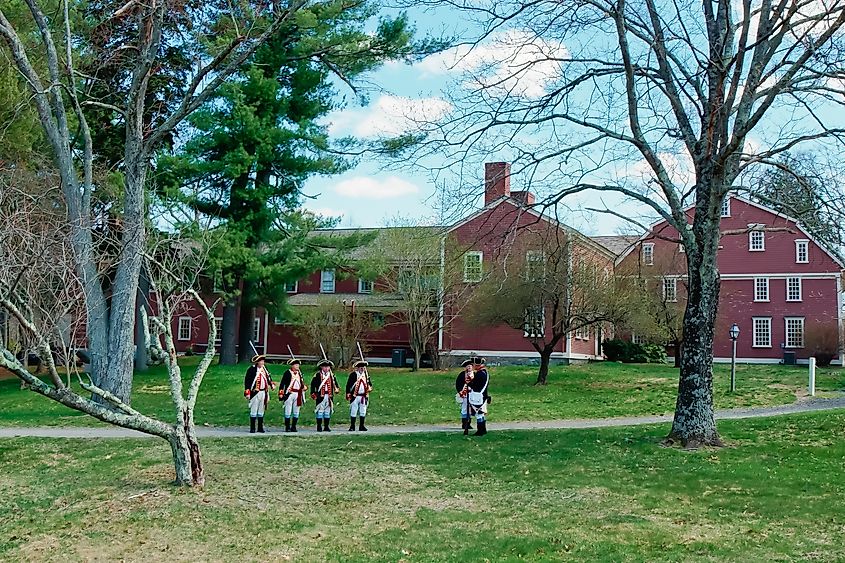 Massachusetts, United States-April 9, 2021: American Revolutionary War reenactor parade in Wayside Inn Historic District Sudbury