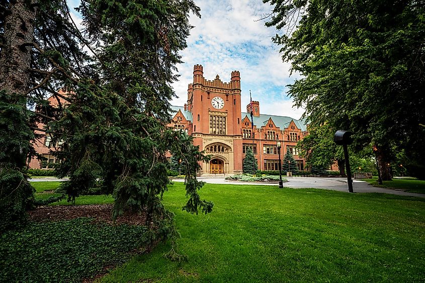 Pine trees frame the University of Idaho administration building.