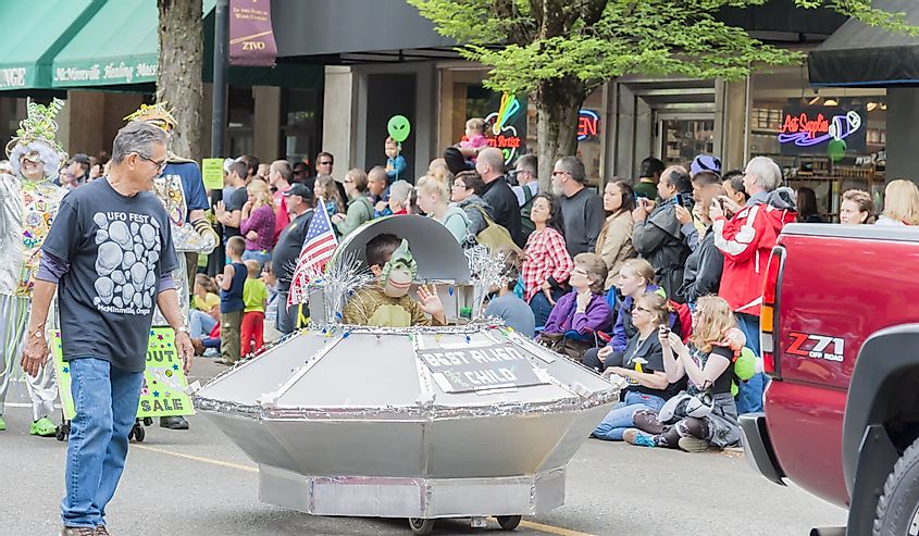 Alien child rides in his spaceship in the parade of the annual UFO Festival in McMinnville, Oregon.