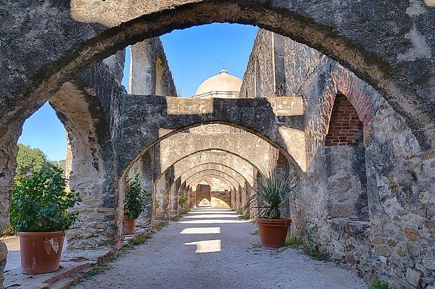 Plants line the archways at the Mission San Jose, Texas