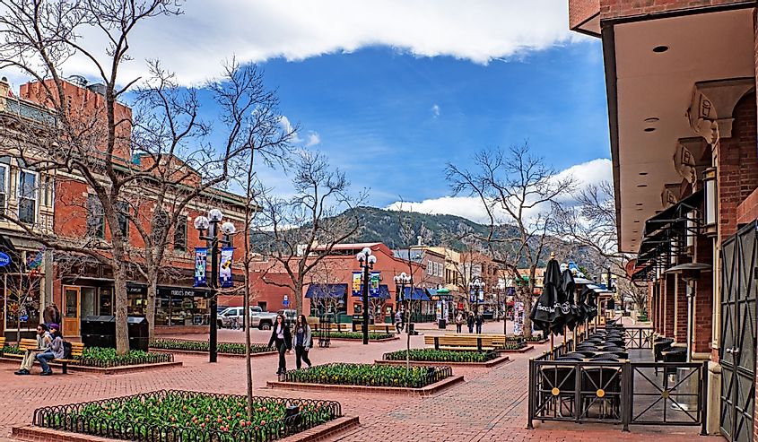 Boulder in early spring at the Pearl Street Mall. Rocky Mountains in the background.
