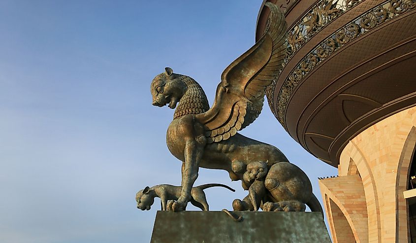  The sculpture of a winged lioness with little lion cubs and the building of the Kazan family center in Kazan