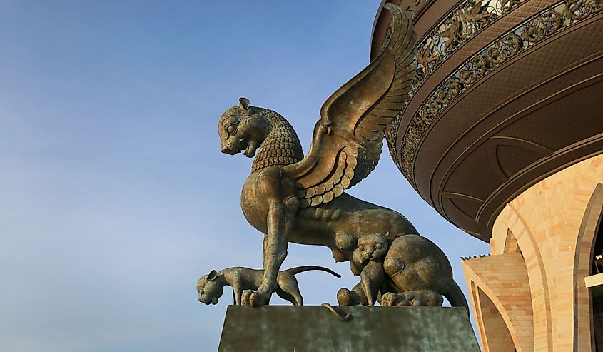 The sculpture of a winged lioness with little lion cubs and the building of the Kazan family center in Kazan