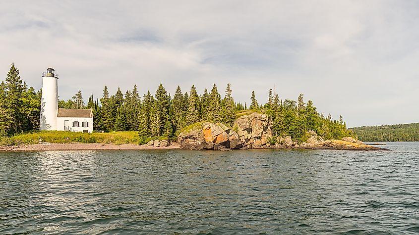 Rock Harbor Lighthouse stands at the intersection of Moskey Basin, Middle Islands Passage, Tonkin Bay, and Lake Superior, in Isle Royale National Park, Michigan.