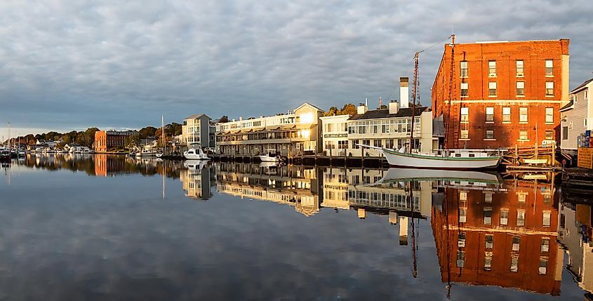 Mystic, Stonington, Connecticut, United States - October 26, 2018: Panoramic view of old historic homes by the Mystic River during a vibrant sunrise.