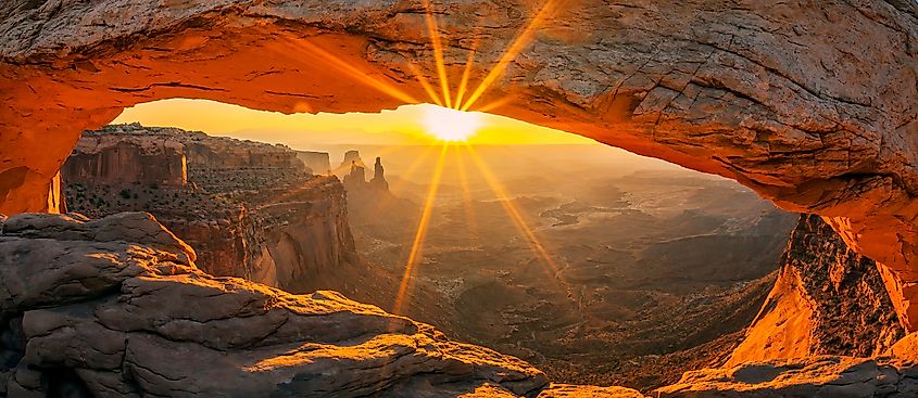 Sunrise through Mesa Arch in the Island in the Sky district of Canyonlands National Park, Utah.