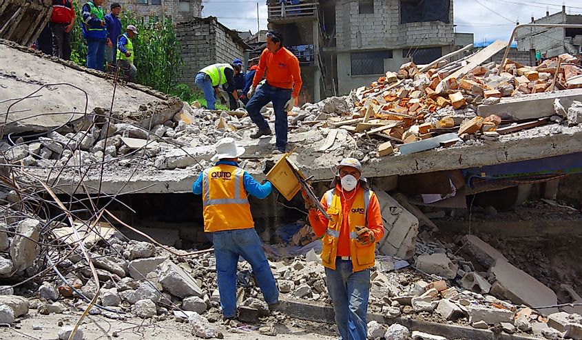 House destroyed by Earthquake with rescuers and heavy machinery in the south part of the city