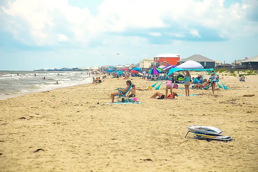People enjoying a a busy summer beach day in Dauphin Island, Alabama