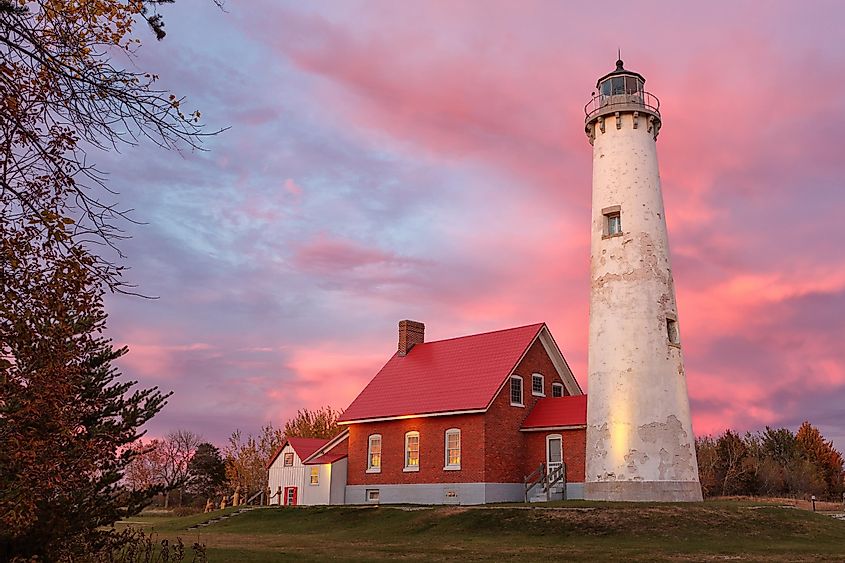 Tawas Point Lighthouse at Sunset in Tawas Michigan.