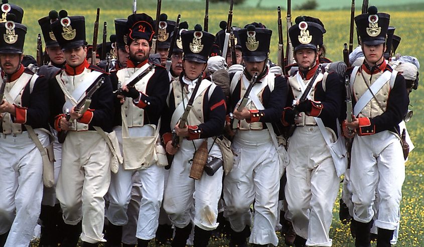 Historical reenactors dressed as Napoleonic line infantry. 