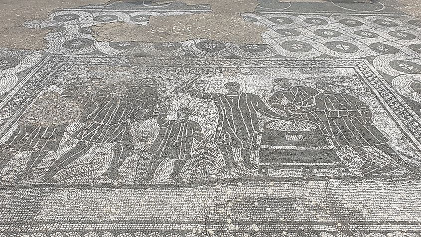 Mosaic depicting grain measurers (mensores frumentarii) at work. MumblerJamie, CC BY-SA 2.0, via Wikimedia Commons)