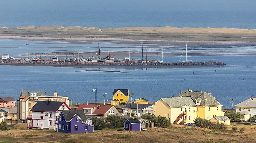 The colour houses and fishing boats of Havre Aubert, Iles de la Madeleine, on the gulf or St Lawrence in Canada.