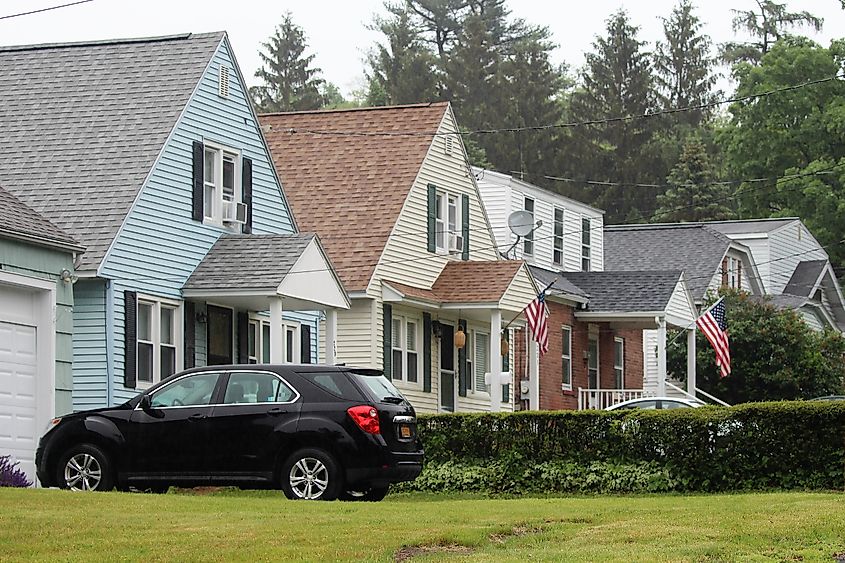 Series of suburban homes in the Hampton Manor neighborhood of East Greenbush, New York, lined along a quiet residential street