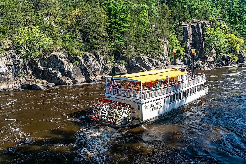 Tourists aboard a boat on the St. Croix River in Taylor Falls, Minnesota