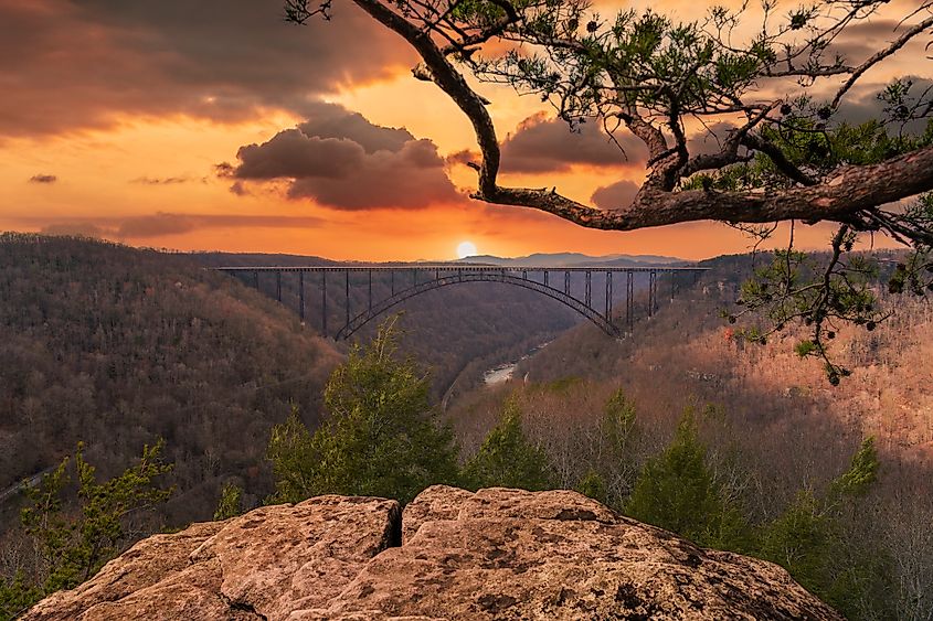 The New River Gorge Bridge bathed in a West Virginia sunset. Credit: Abstract Artist USA/Shutterstock.com