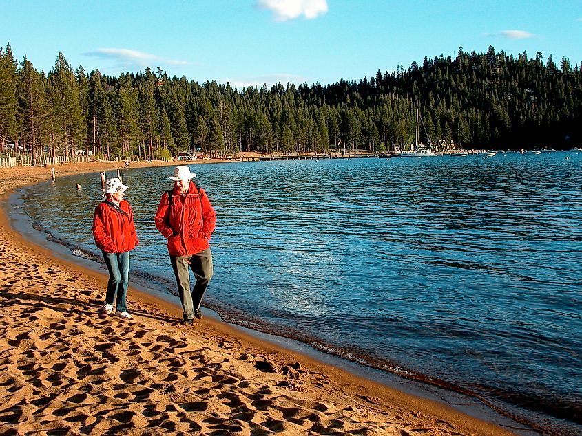 Senior couple strolling on the beach, Zephyr Cove, Lake Tahoe, Nevada