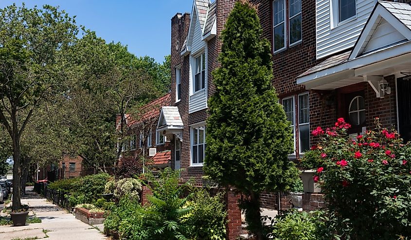 Row of beautiful homes with gardens in Sunnyside, Queens, New York