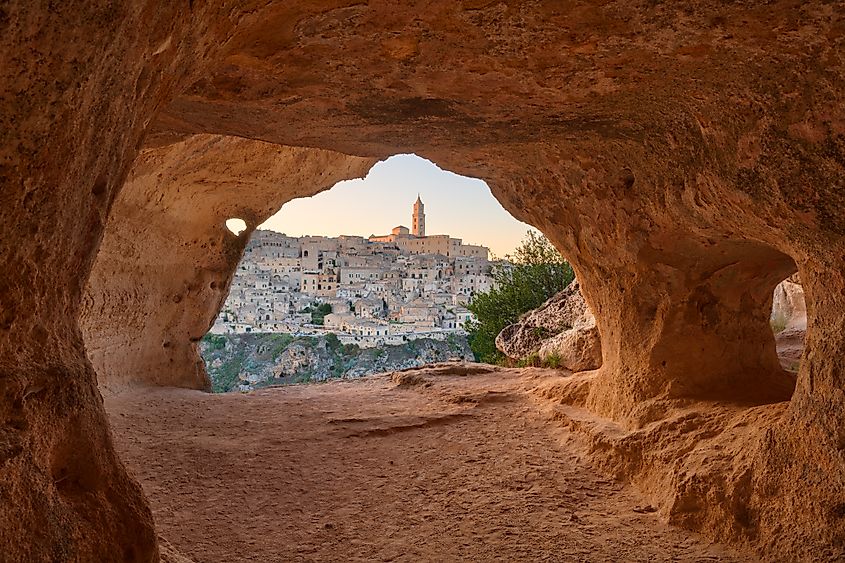 Matera, Italy, as seen from an ancient cave at dusk.