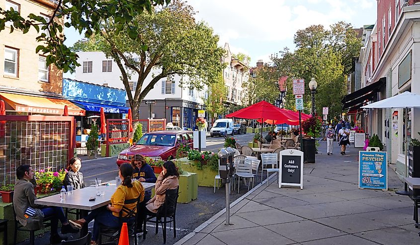 View of people eating on outdoor patios on Witherspoon Street in downtown Princeton, New Jersey