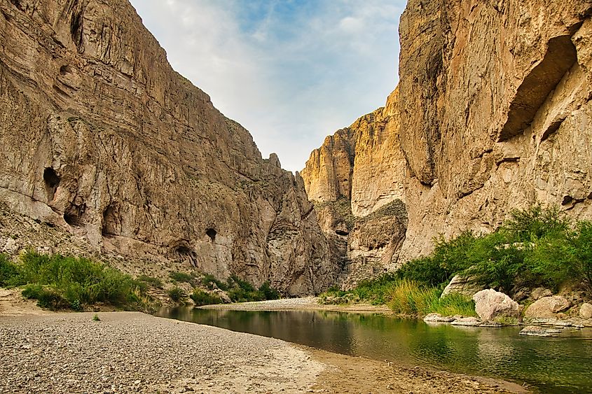 A small stream flows between tall rock walls inside a canyon at Big Bend National Park in Brewster County, Texus. Credit: Dave Jonasen/Shutterstock.com