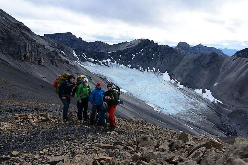 Group of hikers overlooking a glacier in the Gates of the Arctic National Park and Preserve.