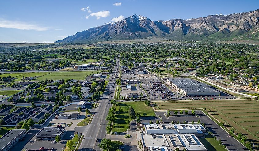 Washington Blvd and the commercial district of North Ogden, Utah with Ben Lomond Peak and the Wasatch Mountains visible in the background