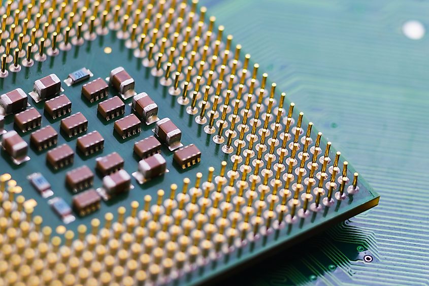 The gold-plated legs of the CPU, laid out on the computer motherboard.