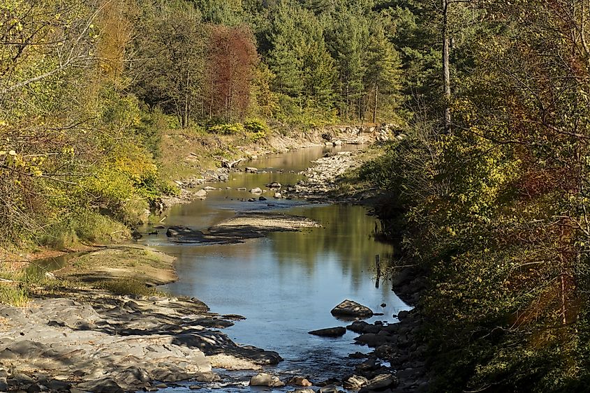 Vermont stream with autumn colors. Rutland, Vermont with water reflecting fall colors. 
