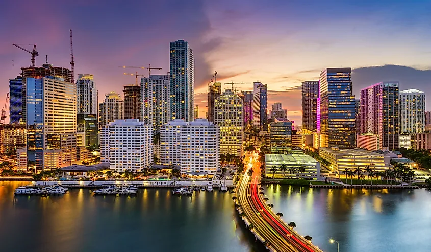 Miami, Florida, US skyline on Biscayne Bay at night with city lights.