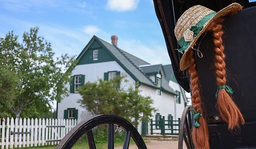 A hat and red hair of Anne Shirley on the carriage in front of her house in Green gables heritage, Cavendish, Prince Edward Island.