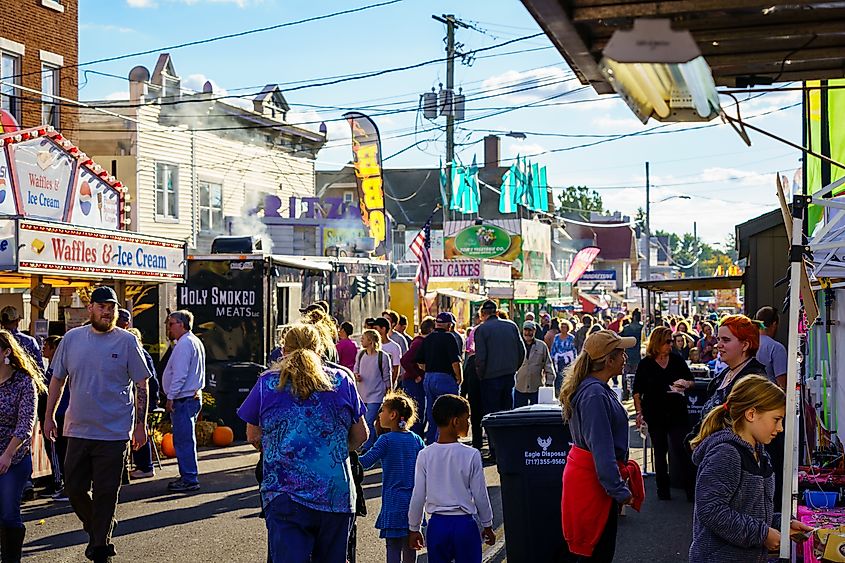 People roam the main streets of the town during the annual New Holland Farmers Fair.