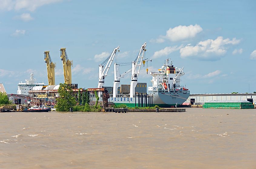 Cranes and machinery aboard ship for loading container vessels at terminal on Mississippi River. Via Shutterstock / Joe Ferrer
