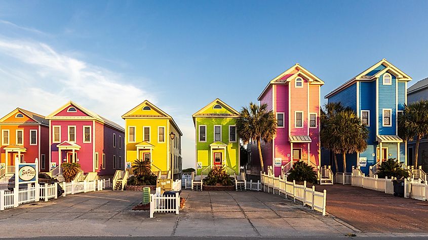 A row of colorful beachfront homes on a sunny afternoon in St. George Island, Florida.