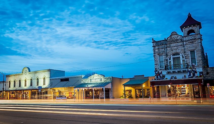 Fredericksburg, Texas, beautiful city night of road and land transportation against lighting