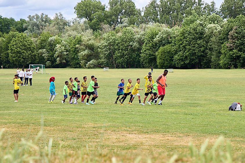 youth football training session in an outdoor park. Editorial credit: beautiful-photo.de Oleg B / Shutterstock.com 