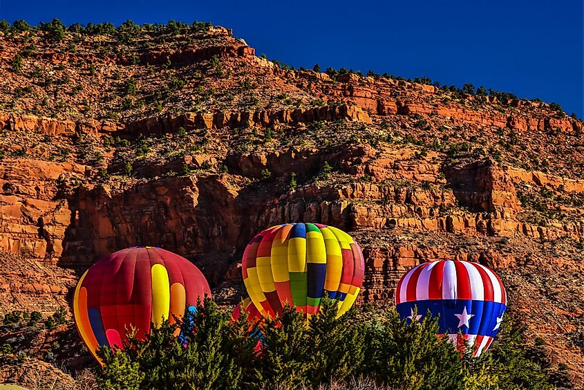 Hot Air Balloons rise above the desert landscape in Kanab